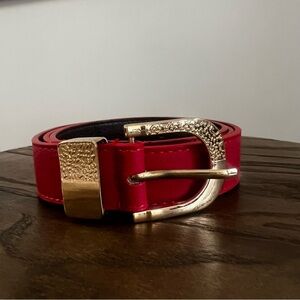 Faux red leather belt with shiny gold hardware